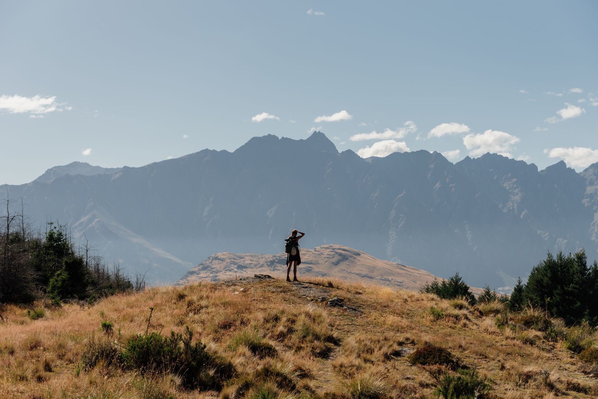 Solo hiker overlooking the Remarkables, Queenstown